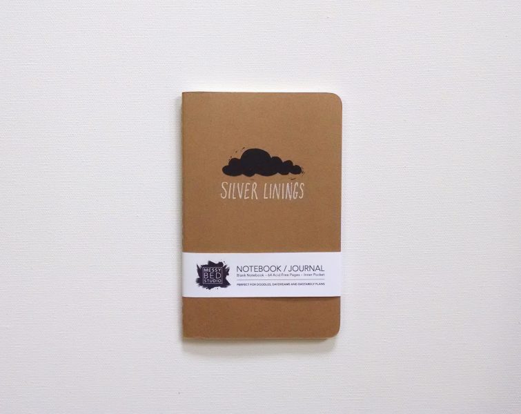 packaged silver linings hand printed notebook with black cloud and silver metallic words