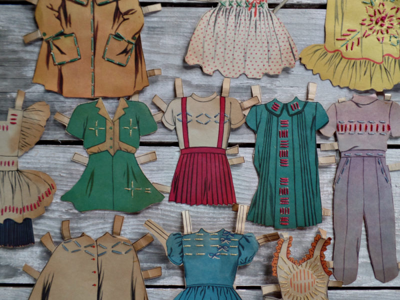 vintage paper doll clothes with embroidered stitches