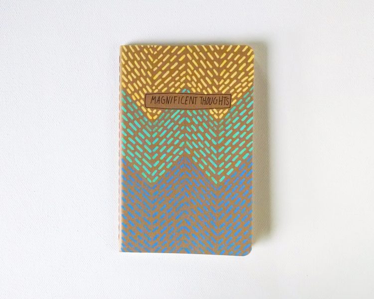 magnificent thoughts notebook handpainted in yellow, aqua and blue by messy bed studio