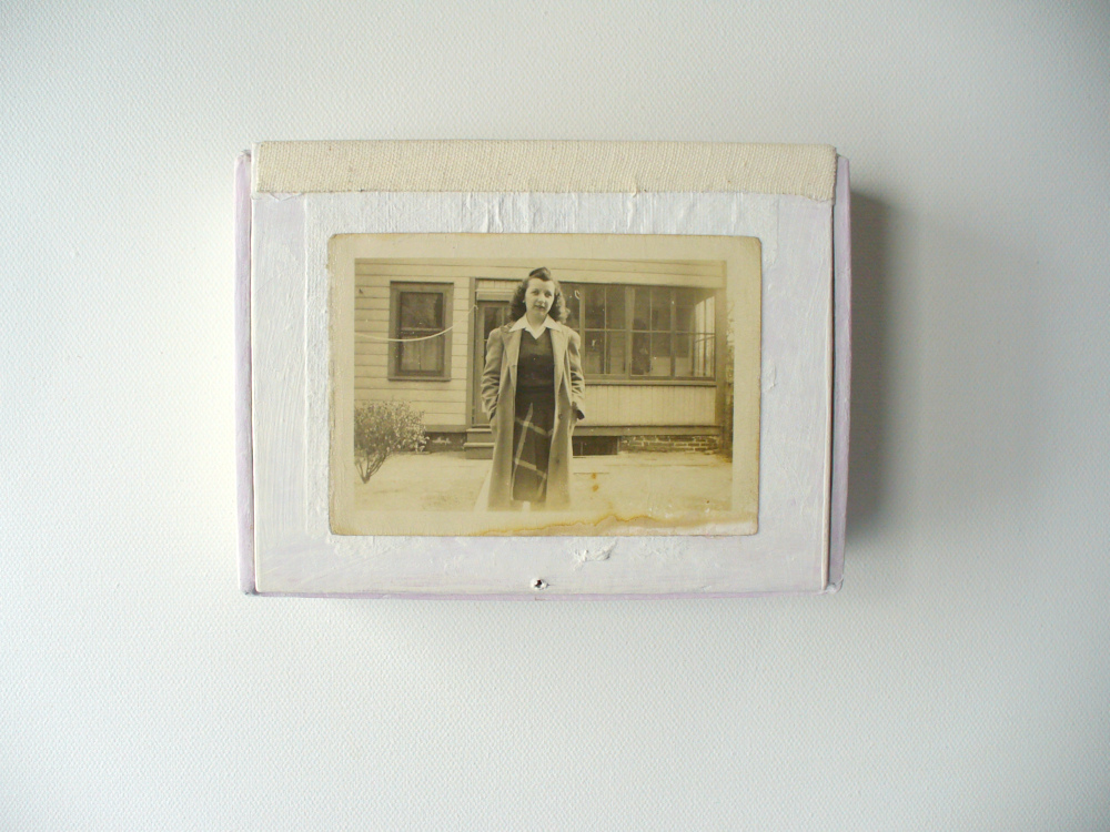 closed goddess shrine in white paint and vintage photo of woman in front of a house