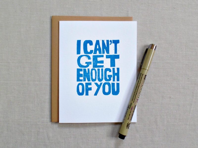 greeting card with envelope that says i can't get enough of you with pen