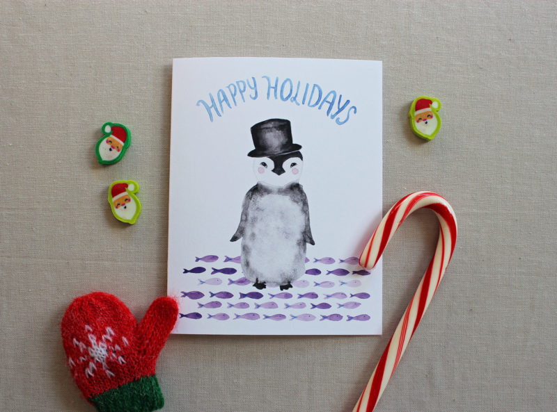 penguin happy holidays card with christmas decorations