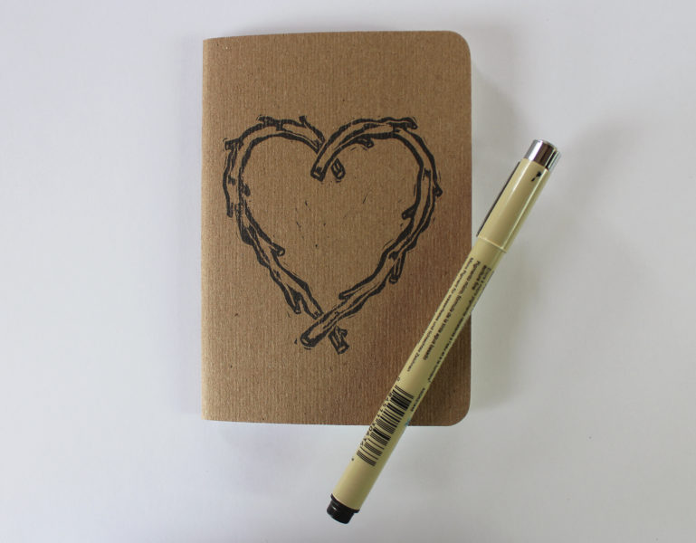 small notebook with hand printed heart