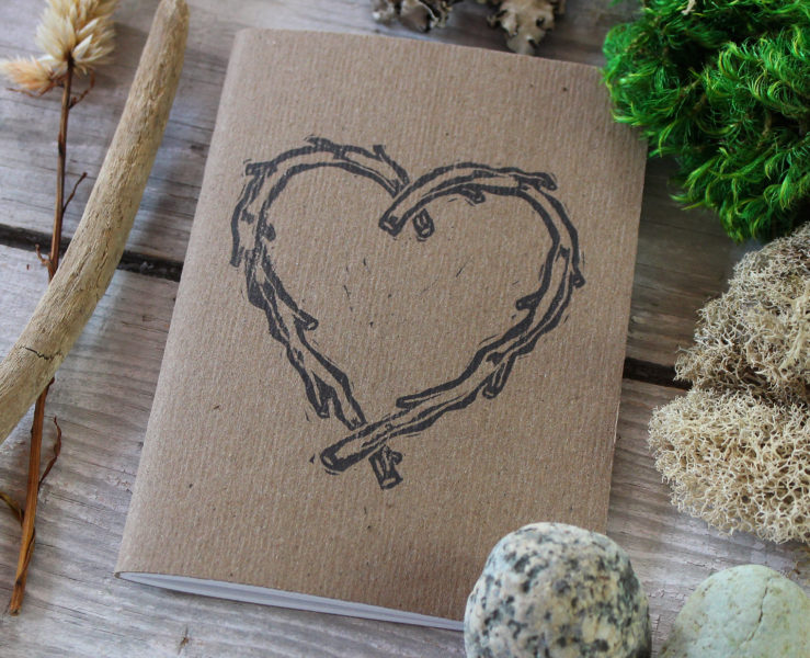 detail of rustic heart vow book for wedding vows