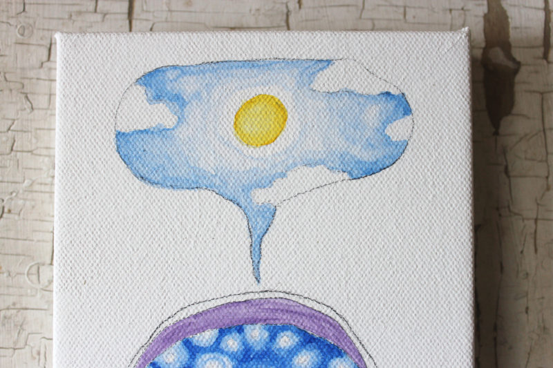 detail of teacup full of sky with sun and clouds
