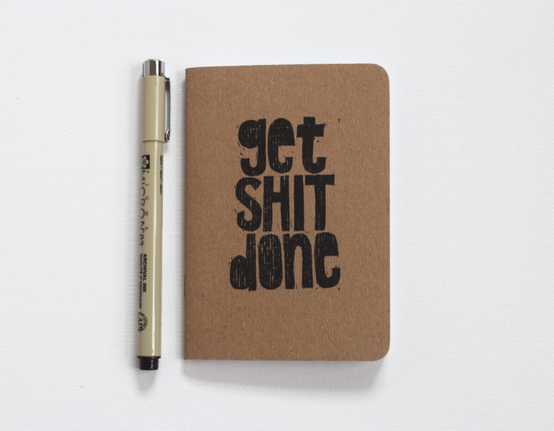 get shit done notebook shown with pen