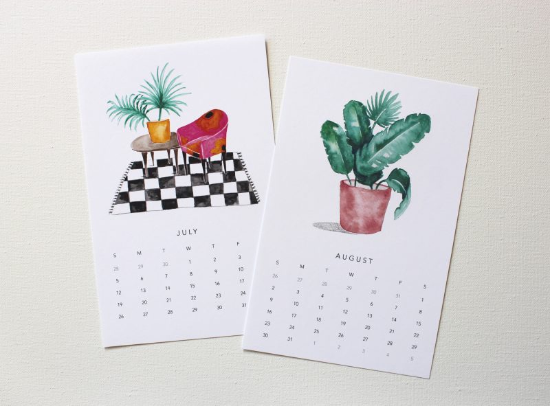 July and August from the 2021 happy house plants calendar with illustrations of a plant on a table next to a pink and orange chair on a black and white checkered rug by messy bed studio