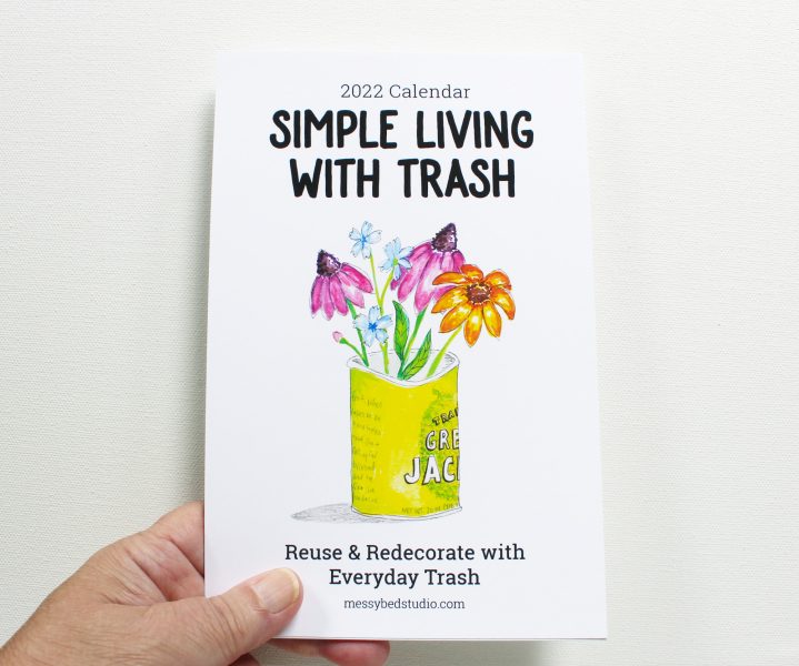 Simple Living with Trash 2022 wall calendar held in a hand