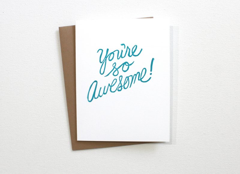 hand printed You're so Awesome note card printed in turquoise ink on a white card with a kraft colored envelope