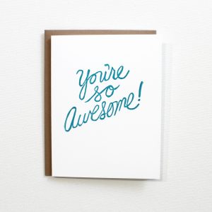 you're awesome card block printed in script in turquoise ink on a white card with and kraft envelope