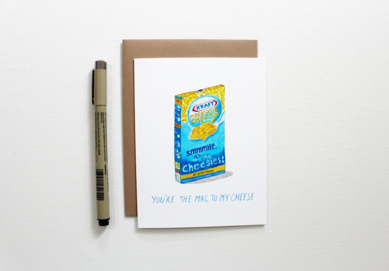 you're the mac to my cheese food pun anniversary card with a watercolor box of kraft macaroni and cheese next to a pen to show scale